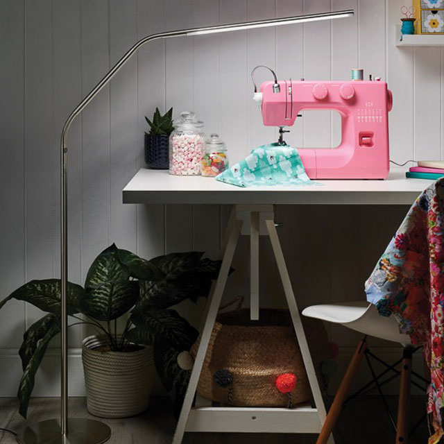 Slimline 3 LED Floor Lamp Illuminating a Sewing Machine