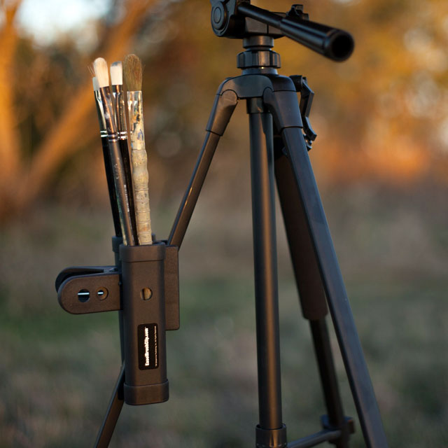 Easel Brush Clip Clipped onto a Tripod Leg